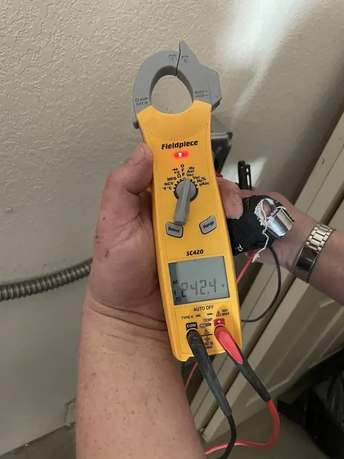 Voltage testing with clamp meter during Recessed Lighting Installation in Russellville